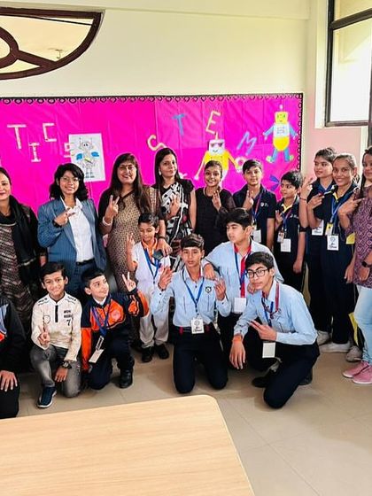 A proud group of participants and mentors at the Robotics Olympiad. Our events foster a collaborative and inspiring environment for young tech enthusiasts.