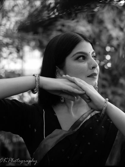 A black and white version of an expressive portrait, which adds a timeless and classic feel to the image.