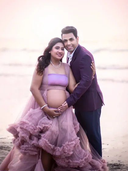 A classic couple portrait by the sea, capturing the beautiful bond you share during this special time.