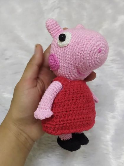 A side profile of the adorable Peppa Pig plushie. It shows her unique shape and cute little ears. I make sure every angle is perfect for your little one's new best friend.