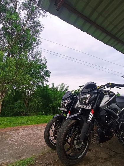 Two black Dominars parked together, showcasing their powerful and imposing presence. Brothers in arms.