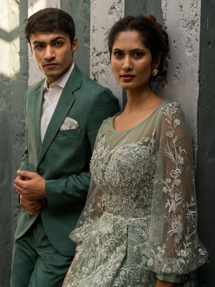 A closer view of the intricate embroidery on her gown and the sharp tailoring of his suit. We focus on the details to make you both look your best.