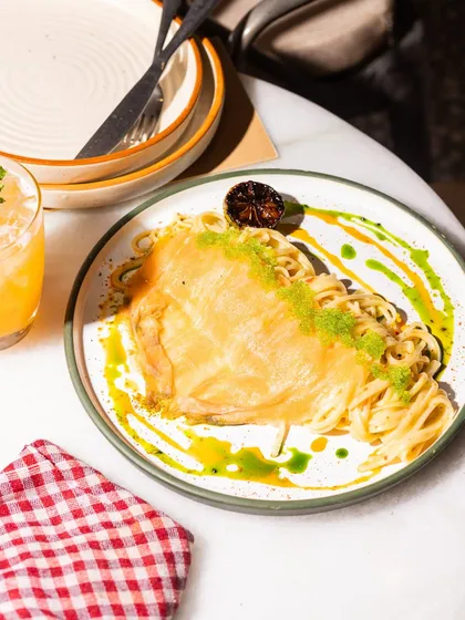 A truly special dish, my Linguine with Salmon Carpaccio features delicate slices of fresh salmon over pasta tossed in a creamy yuzu butter and finished with a pop of tobiko.