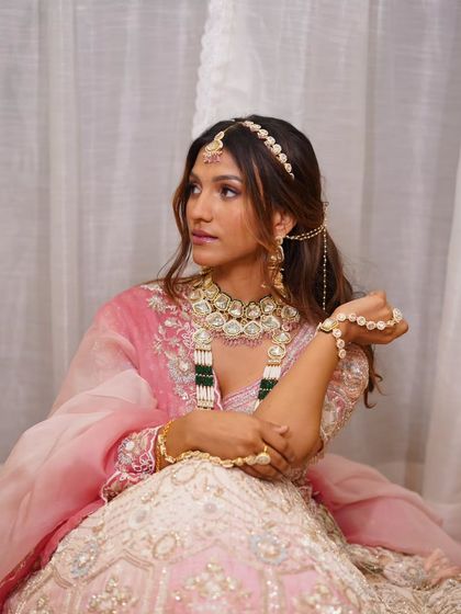 A closer look at the delicate details of our pink and white ombre bridal lehenga. The craftsmanship and the matching jewellery set create a truly special look.