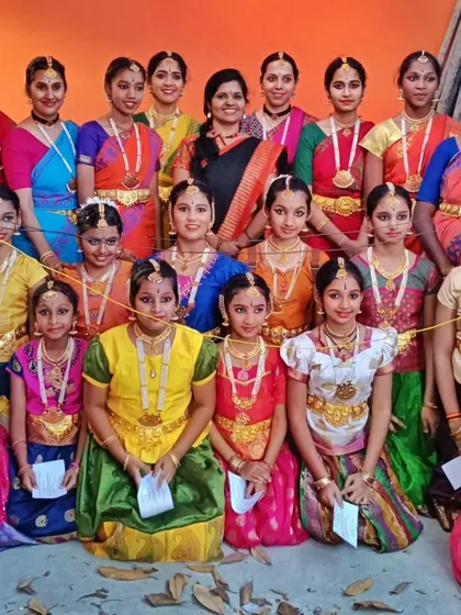 Another large group photo celebrating the successful completion of the Gandharva exams across different levels.