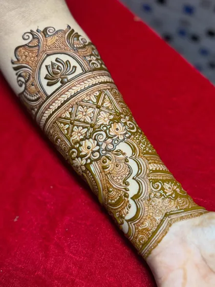 The completed arm band design, a beautiful and intricate piece of henna art.