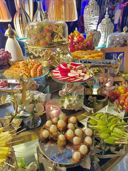A closer look at our magnificent dessert and fruit grazing table. The variety is endless, with something to satisfy every sweet tooth, from cheese platters to chocolate-dipped fruits.