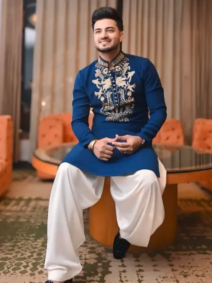 The royal blue kurta paired with a white patiala salwar for a traditional Punjabi look.