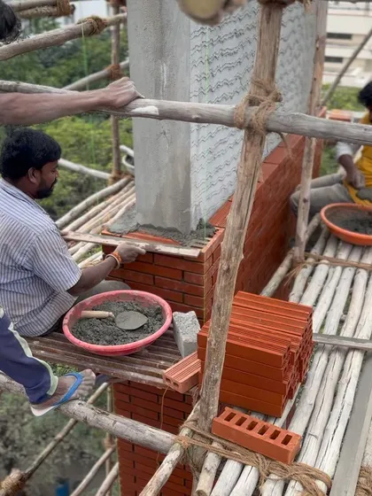 Duplicate image of the bricklaying process.
