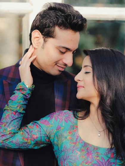 A sweet and tender moment between the couple. The makeup is fresh and radiant, perfect for capturing their love.