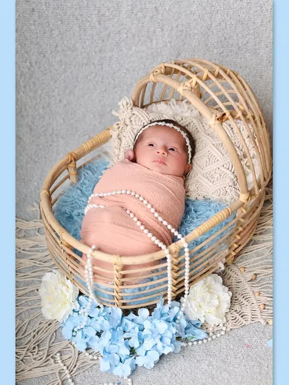The same beautiful setup, but this time the baby is awake and looking around, allowing us to capture her curious expression.