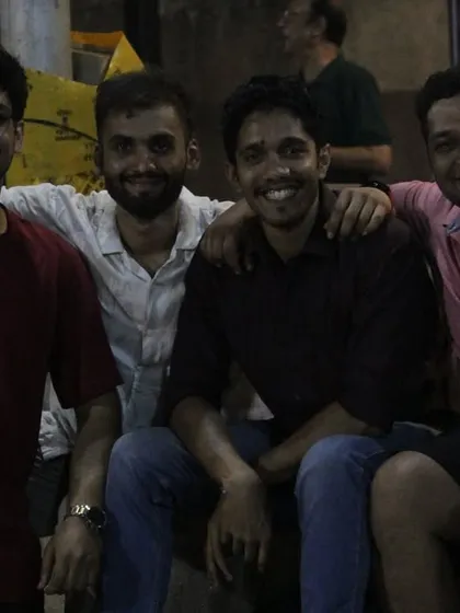 Friends and teammates enjoying the tournament from the sidelines.