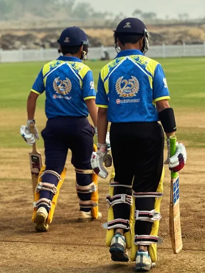 Two of our opening batsmen walking out to the pitch together. Partnership is key, both on and off the field.