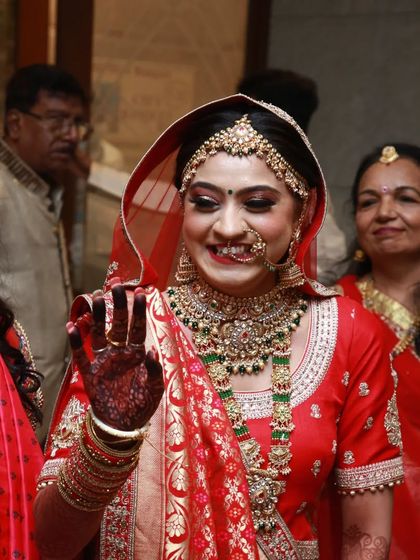 A beautiful bride on her wedding day. The rich stain of her mehndi is a key part of her traditional bridal look.