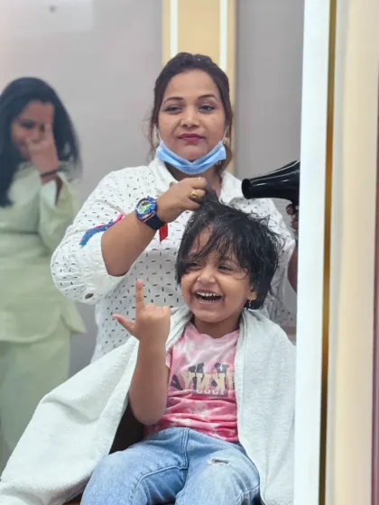 Pure joy and excitement during a haircut. We aim to make every visit a fun memory for our little clients.