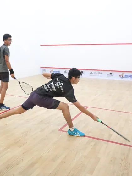 A player stretches to return a drop shot. The level of skill and determination at our national tournaments is always inspiring.