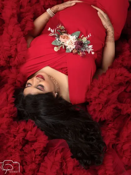 A portrait of pure serenity. The sleeping pose on a bed of red tulle is one of my most requested shots for its elegance and peaceful, dreamy quality.