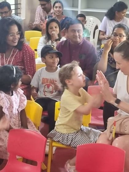 Parents and children participate in an interactive activity during orientation. These moments help build a strong, supportive community from day one.