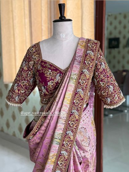 A closer look at the sweetheart neckline and detailed sleeves of the maroon bridal blouse, showcasing the fine craftsmanship.