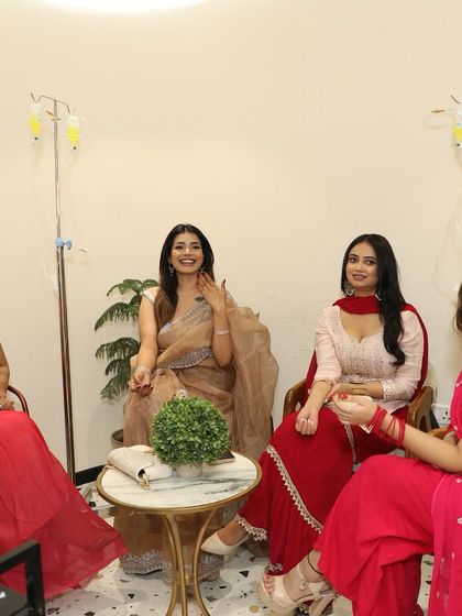 A group of friends getting their pre-Diwali glow-up together. IV therapy can be a shared wellness experience.