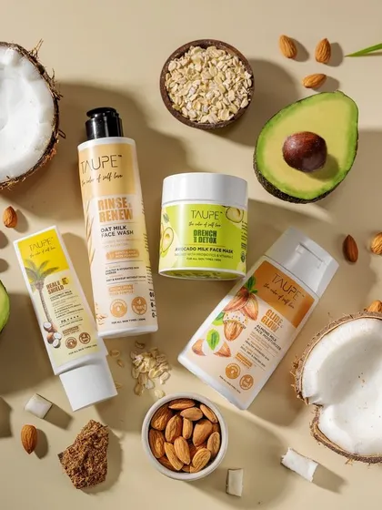 A comprehensive flat lay featuring the full range of Taupe products with their corresponding ingredients. This type of hero shot is perfect for website banners and promotional materials, telling the entire brand story in one image.