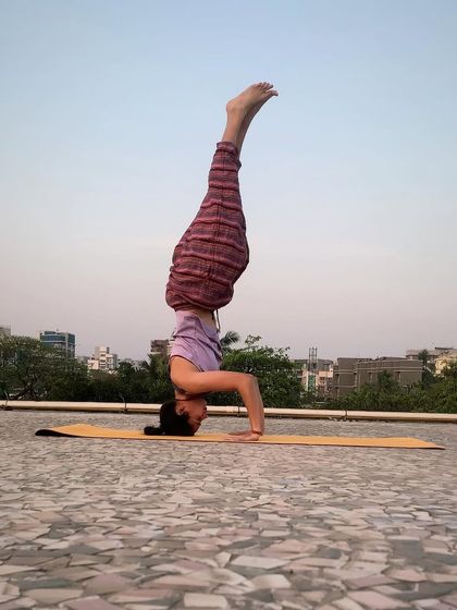 A variation of Sirshasana (Headstand) against the city skyline. Inversions shift our perspective, both literally and figuratively, and I'm always learning something new in the process.