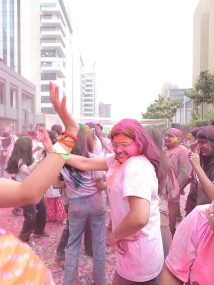 More candid moments from a corporate Holi party, capturing the spontaneous fun and vibrant colors of the festival. This reflects the immersive experience we provide for all attendees.