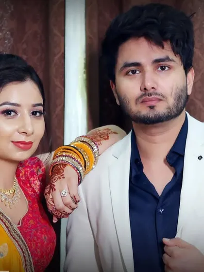 A classic portrait of the engaged couple. The bride's henna and traditional bangles are visible, adding cultural details to this photograph from their sagan.