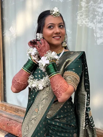 A happy, smiling bride on her Haldi day.