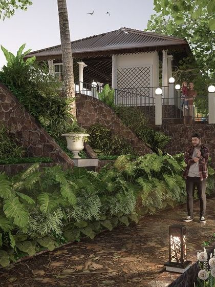 This image shows the use of curved retaining walls and terraced planting to manage the steep slope at Nilaya Residence. Custom-designed bollard lights provide gentle, ambient illumination along the natural walking paths, enhancing the garden's atmosphere at night.