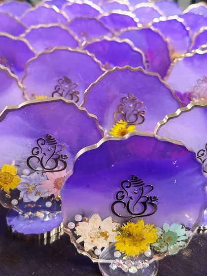 Another look at the beautiful purple Ganesha coasters. Each one is unique because of the real flowers used.