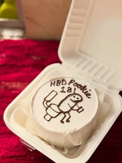 A fun and quirky bento cake for an 18th birthday. I can create custom cartoon drawings to match any personality or inside joke.