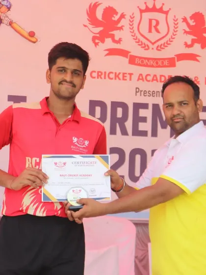 Another proud member of the RCA Kings receives his certificate after a successful tournament.