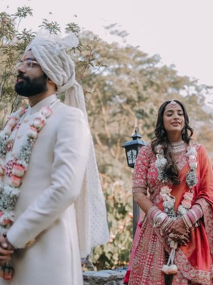 A "first look" moment, where the bride approaches the groom from behind before the ceremony begins.