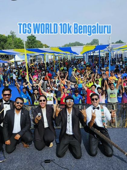 The band posing with the massive crowd at the TCS World 10K in the background. Performing at major city events like this is always a thrill.