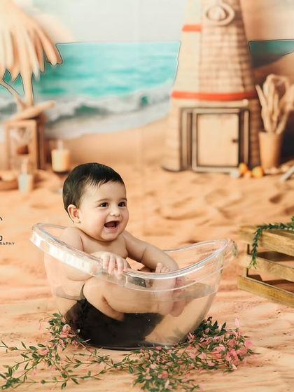 Splish, splash, and a whole lot of laughs in a beach themed tubby time shoot. This creative studio setup brings the seaside indoors for a fun and unique baby session.