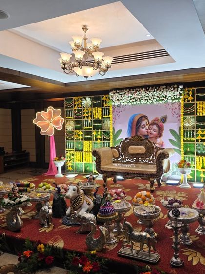 An angled view of the Krishna-themed naming ceremony stage.