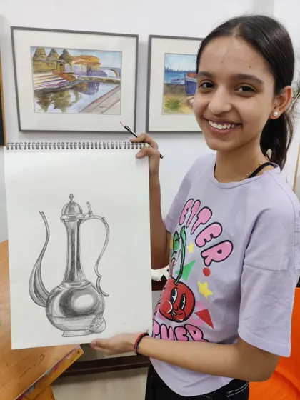 More images of our dedicated young artists at work and proudly displaying their creations.