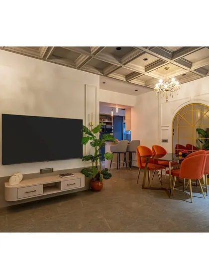 This perspective shows the interplay of light and shadow, with chandeliers and ambient lighting creating a warm and inviting atmosphere in the evening. The glossy floor reflects the light, adding to the room's brightness.