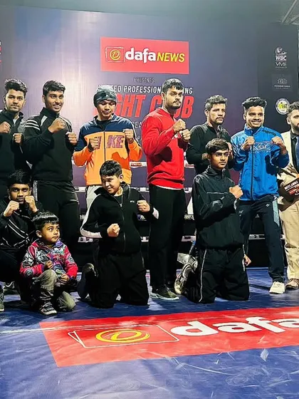 Team CSBA (Chandan Singh Boxing Academy) standing proud in the ring at a professional fight club event. We are a family of fighters, supporting each other every step of the way.