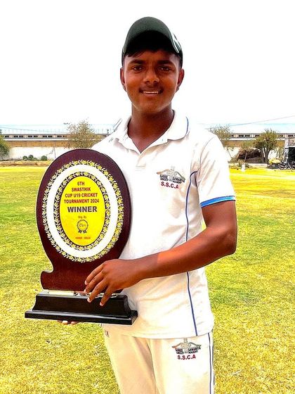 One of our U-19 players holding the winner's shield from the Swastik Cup.