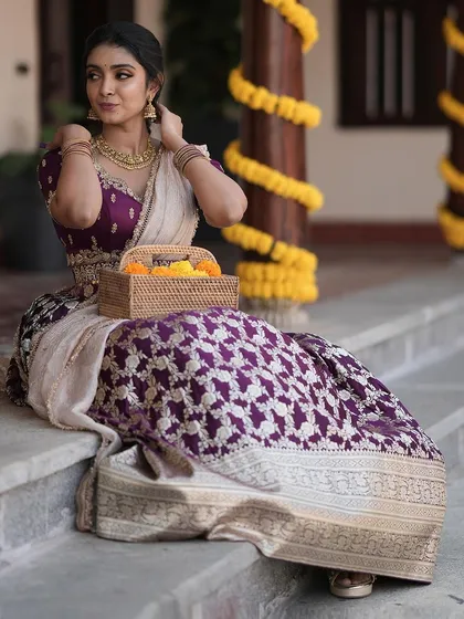 A repeat of the beautiful seated portrait in the purple brocade lehenga.