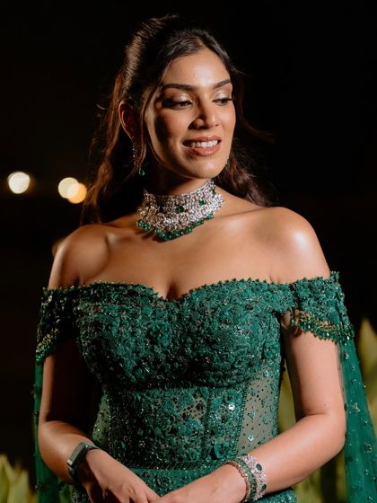 A close-up of the reception makeup, highlighting the dewy skin and soft, defined eyes. It's a look that feels light but has a glamorous impact.