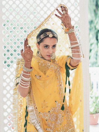 In her yellow poshak with barely-there makeup, this bride's vidai moment was full of emotion. A quiet goodbye and the warmest beginnings.
