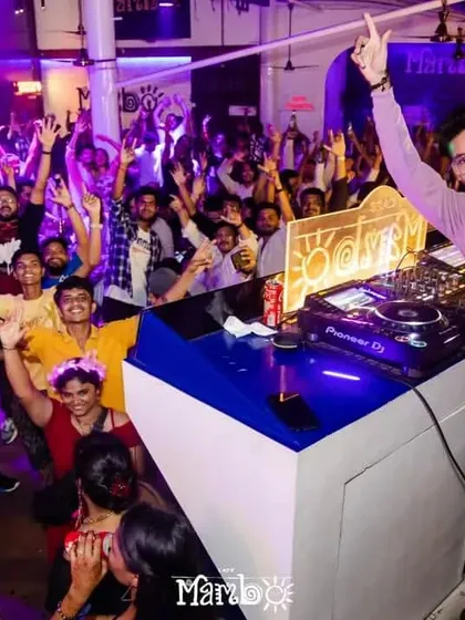 Leading the party from the DJ booth. My goal is to make sure every single person in front of me is having an incredible time.