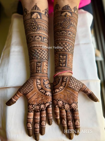 A full-hand Indian design with a mix of peacocks, elephants, and intricate checkerboard patterns.