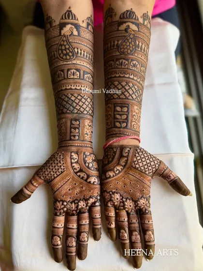 A full-hand Indian design with a mix of peacocks, elephants, and intricate checkerboard patterns.