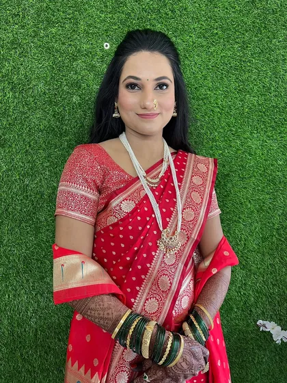 My engagement bride Mayura, looking elegant in a traditional red saree. The makeup is soft and glowing.