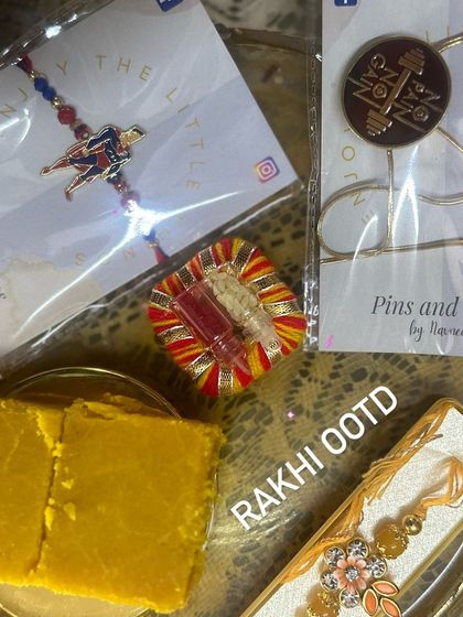 Our Rakhi OOTD. Featuring a unique Superman Rakhi, a 'No Pain No Gain' lapel pin Rakhi, and a traditional floral one. We have a style for every brother.