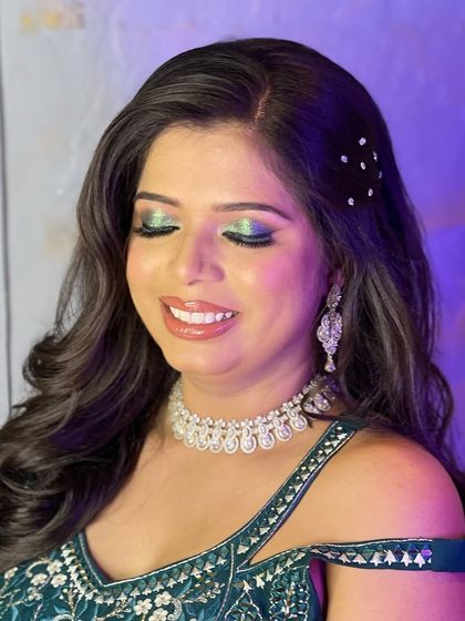 Another look at the versatile American diamond necklace from my rental collection. The client's colorful eye makeup and green outfit are beautifully complemented by the simple sparkle of the jewellery.
